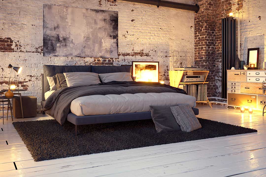 Chambre déco industrielle mur brut en pierre et sol parquet brut